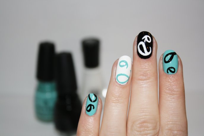 Painted nails black white and turquoise