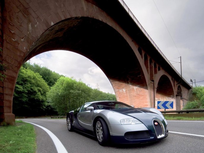 Beautiful car - Bugatti Veyron passing under a bridge