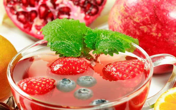 Fresh drink - strawberry, pomegranate, cranberries and mint