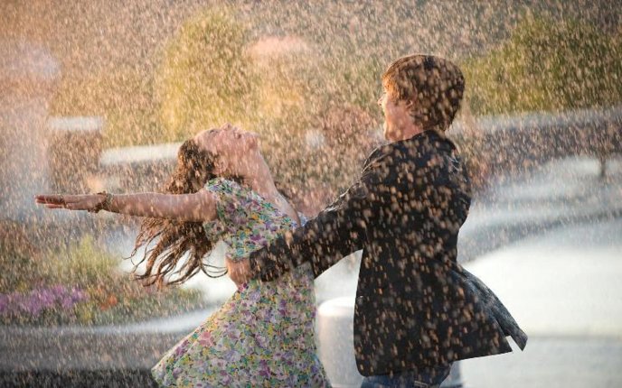 Lovers dancing in the rain