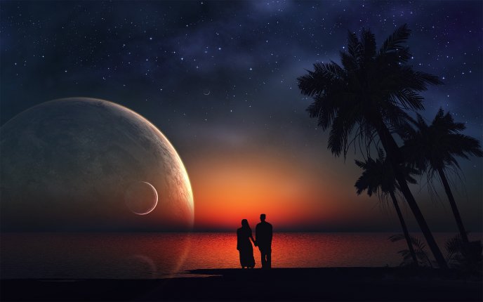 A romantic night  - love on the beach looking at the moon