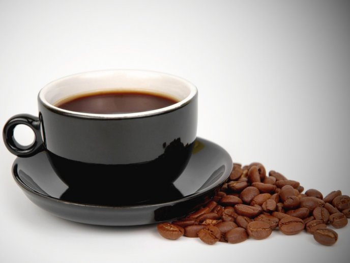 Delicious coffee in a black cup HD wallpaper