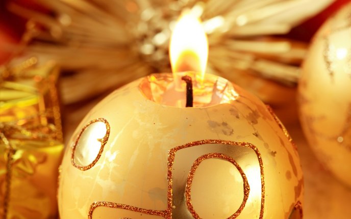 Golden candle in shape of a Christmas ball HD wallpaper