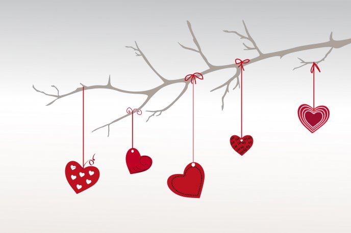 Tree adorned with red hearts