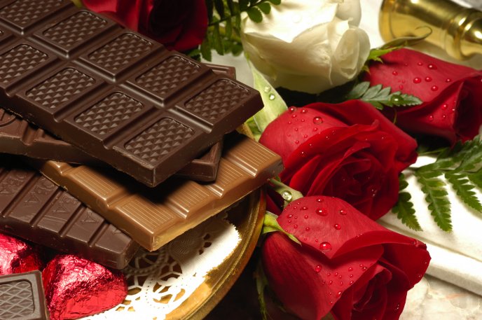 Symbols of love - chocolate and roses
