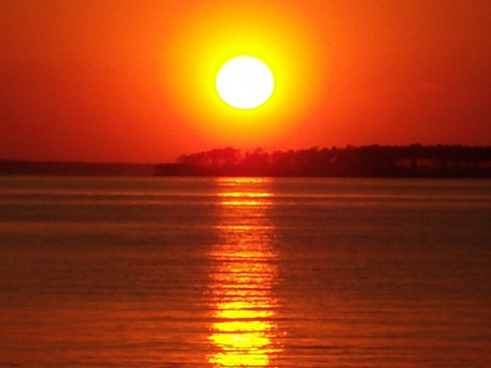 Beautiful sunset - sunlight reflexion in water