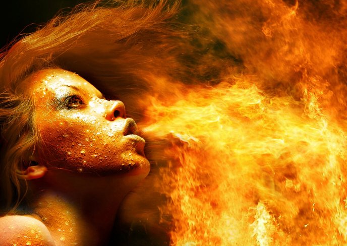 Artistic HD wallpaper - a woman spitting flames