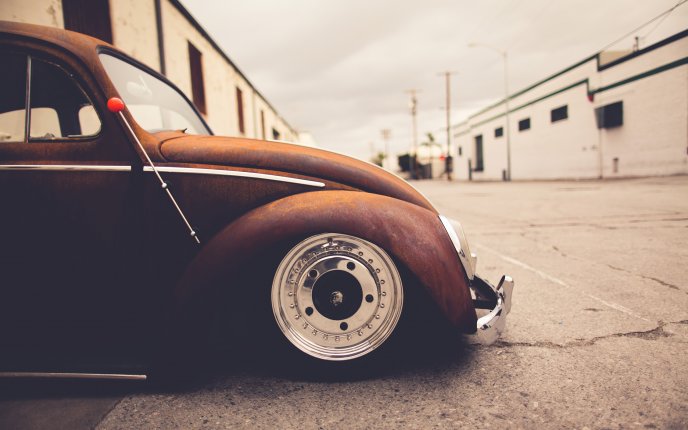 Old classic car - Volkswagen Beetle on the road