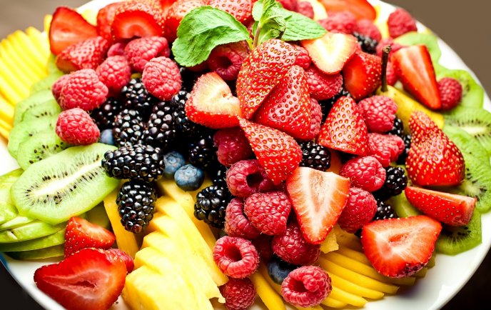 Plate full of healthy fruits - delicious food for dinner