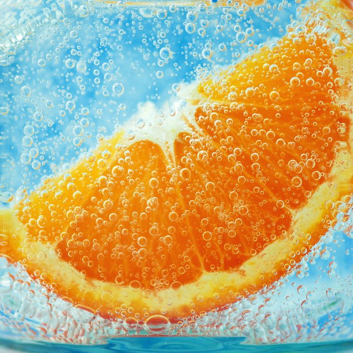 Orange slice in mineral water - fruit juice