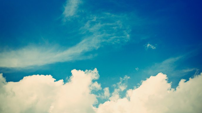 Fluffy white clouds and a blue sky - HD wallpaper