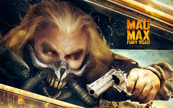Mad Max fury road - Immortan Joe with a gun in the hand