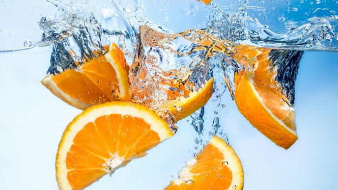Fresh orange slices in the water