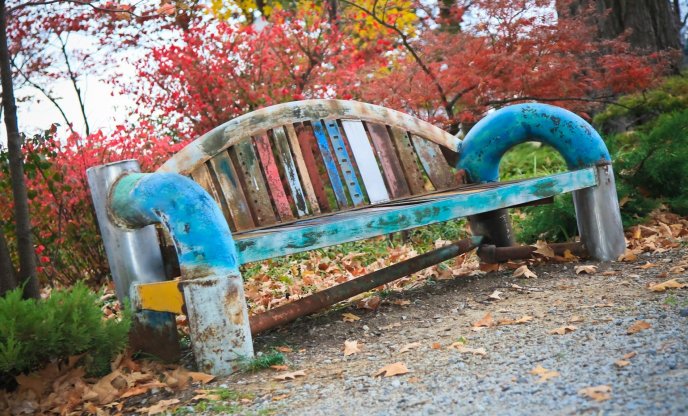 Old and colored bench in a park