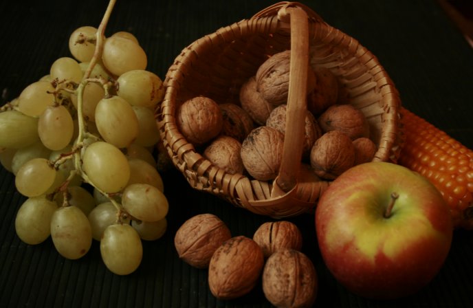 Autumn fruits - grapes, nuts and apples