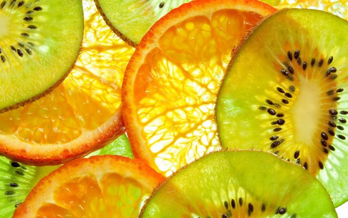 Slice of oranges and kiwi - vitamin wallpaper