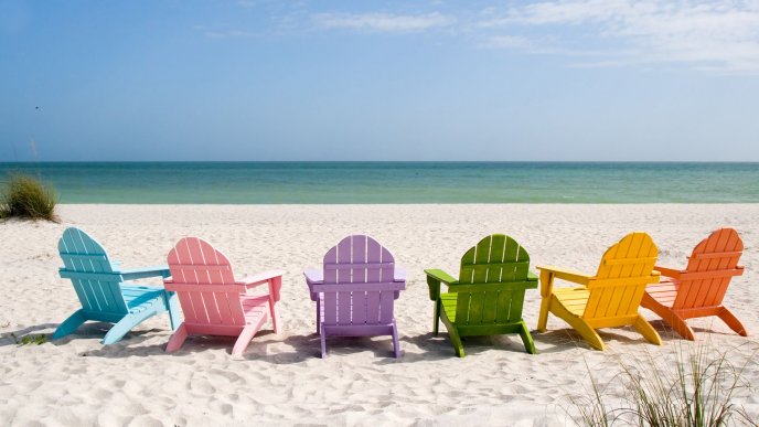 Colored sunbeds on the beach - HD happy holiday