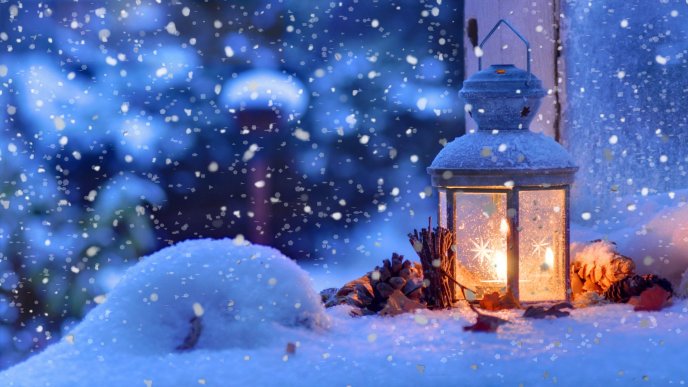 Warm winter season - Candle light in the snow
