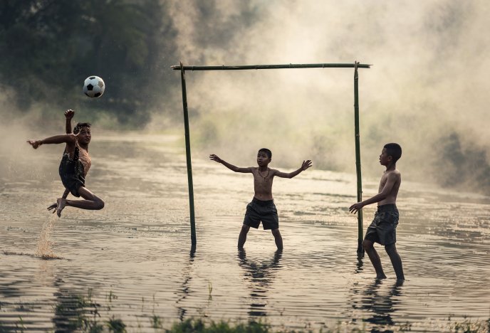 Playing football in the water - Jump action goal score point
