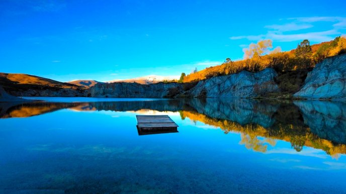 Wooden pontoon in the middle of a mountain lake - Nature
