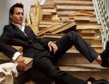 Legendary Johnny Depp sitting on stairs