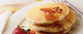 American pancakes with strawberries and nuts