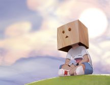 Child with a box on his head