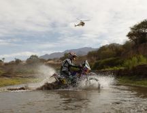 With the motorcycle through the water