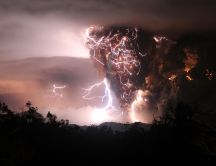 Volcano erupts - lightning on the red sky