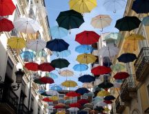 Flying colored umbrellas