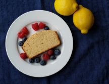 Healthy breakfast - berries, lemon and a slice of bread