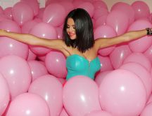 Selena Gomez - among a lot of pink balloons