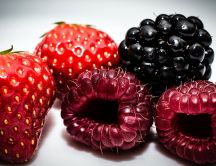 Macro delicious fruits - strawberry, raspberry, blackberry