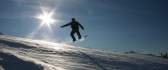 Snowboard jumping in sunlight HD wallpaper