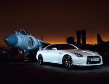 Beautiful white Nissan GT-R35 and military aircraft