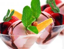 Ice cream with strawberries and mint leaves