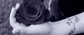 Black and white wallpaper - holding a rose