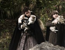 Robb Stark and Bran Stark with two young wolf