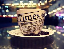 Read the newspaper on a cup of coffee