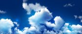 Fluffy clouds on a beautiful blue sky - HD wallpaper