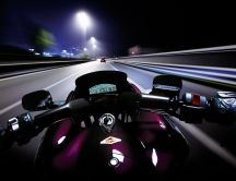 Speed race on a motorcycle in the night