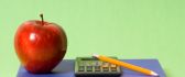 Book, apple, pencil and calculator - basic school stuff