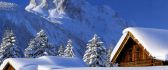Warm wooden chalets in the mountaintop - winter season