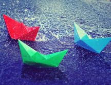 Colored paper boats on the road - Rainy day