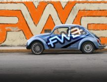 Old Volkswagen Beetle - beautiful graffiti on the wall