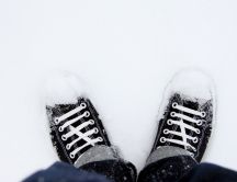 Black shoes in the white snow - Winter season