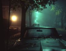 Old car on the road in the middle of the night
