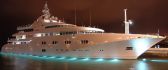 Beautiful white yacht lighted on the water in the night