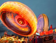 Amusement park rides with many lights
