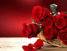 Beautiful red roses bouquet in a basket
